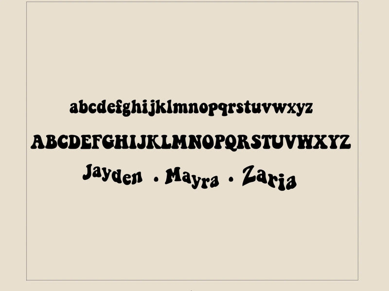 Display of a decorative font with letters and names on a beige background