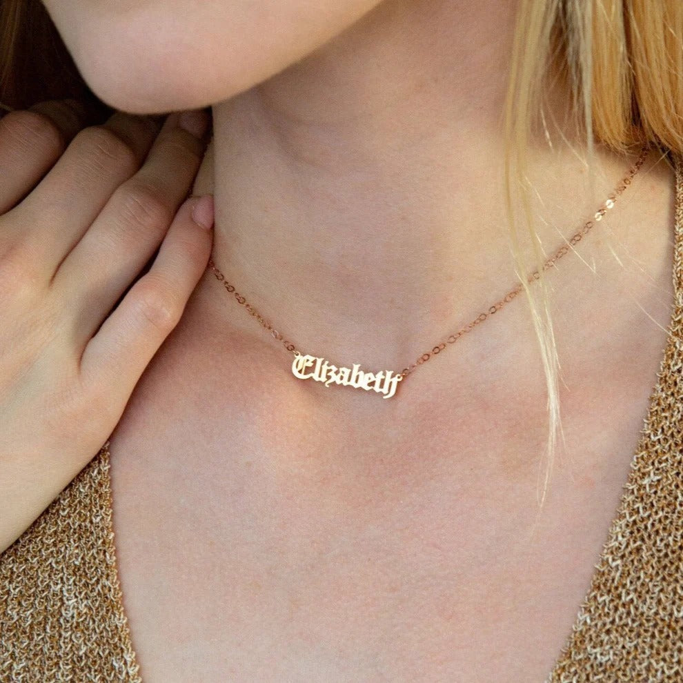 Rose gold 'Elizabeth' necklace on a person's neck
