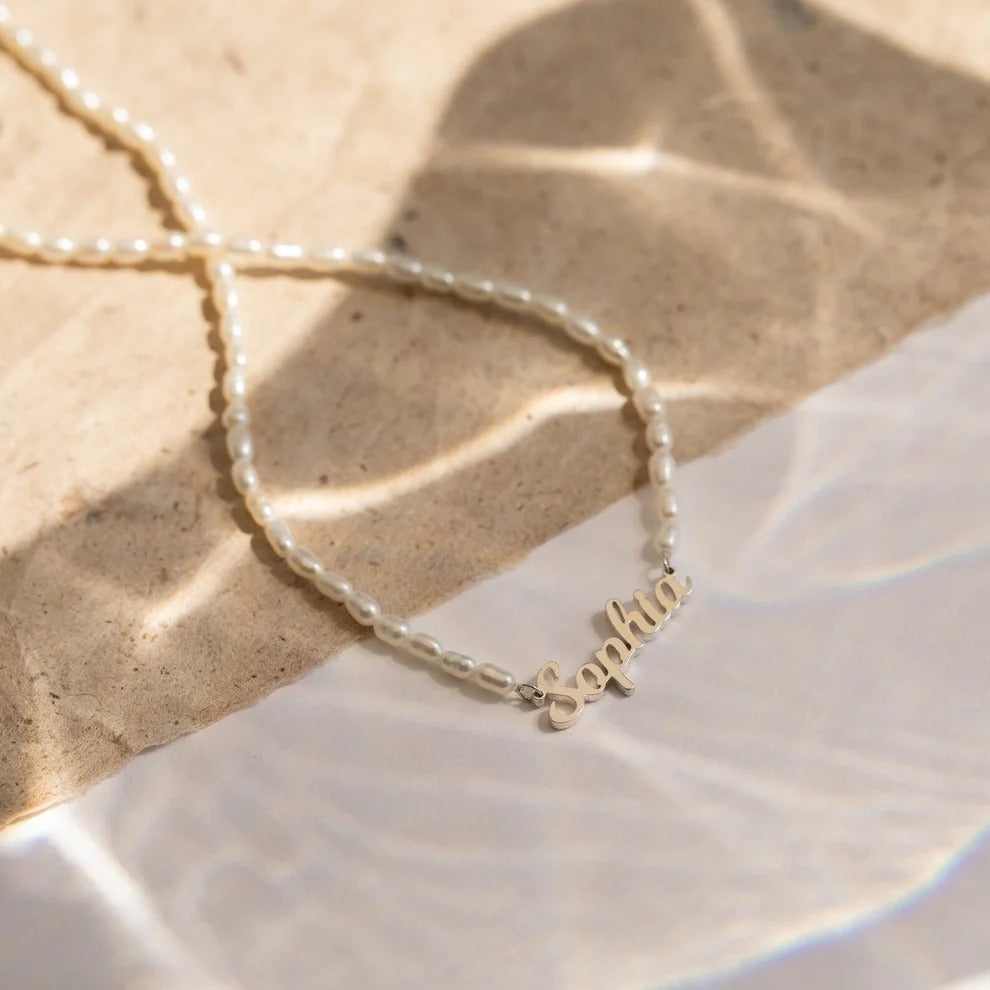 Silver bracelet with 'Sophia' engraving on a textured surface